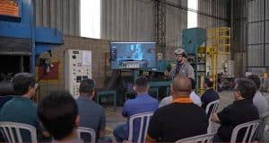 Participants engage in the Blasting Cost Killer workshop, focused on reducing shot blasting costs.